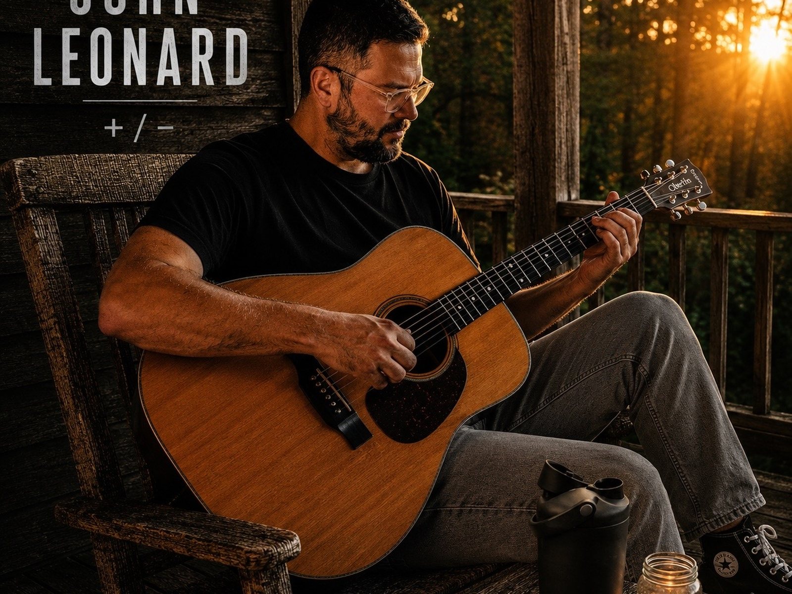 John Leonard playing acoustic guitar